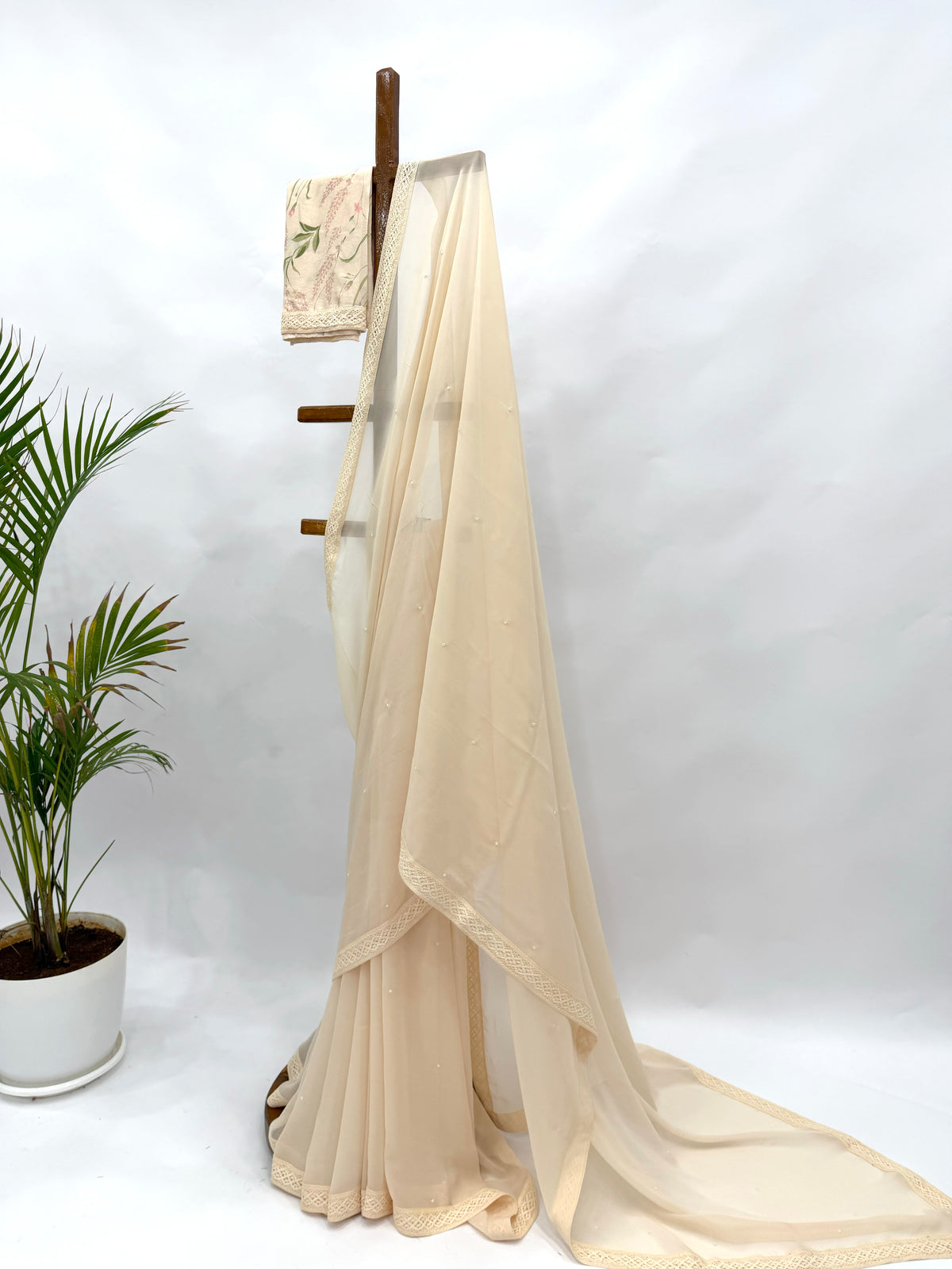 IVORY GEORGETTE SAREE WITH PEARL EMBELLISHMENT AND FLORAL BLOUSE FABRIC