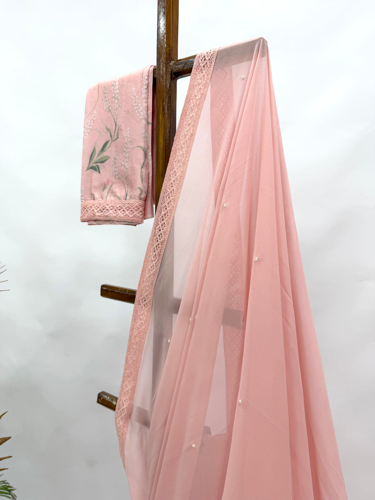 PEACH GEORGETTE SAREE WITH PEARL EMBELLISHMENT AND FLORAL BLOUSE FABRIC