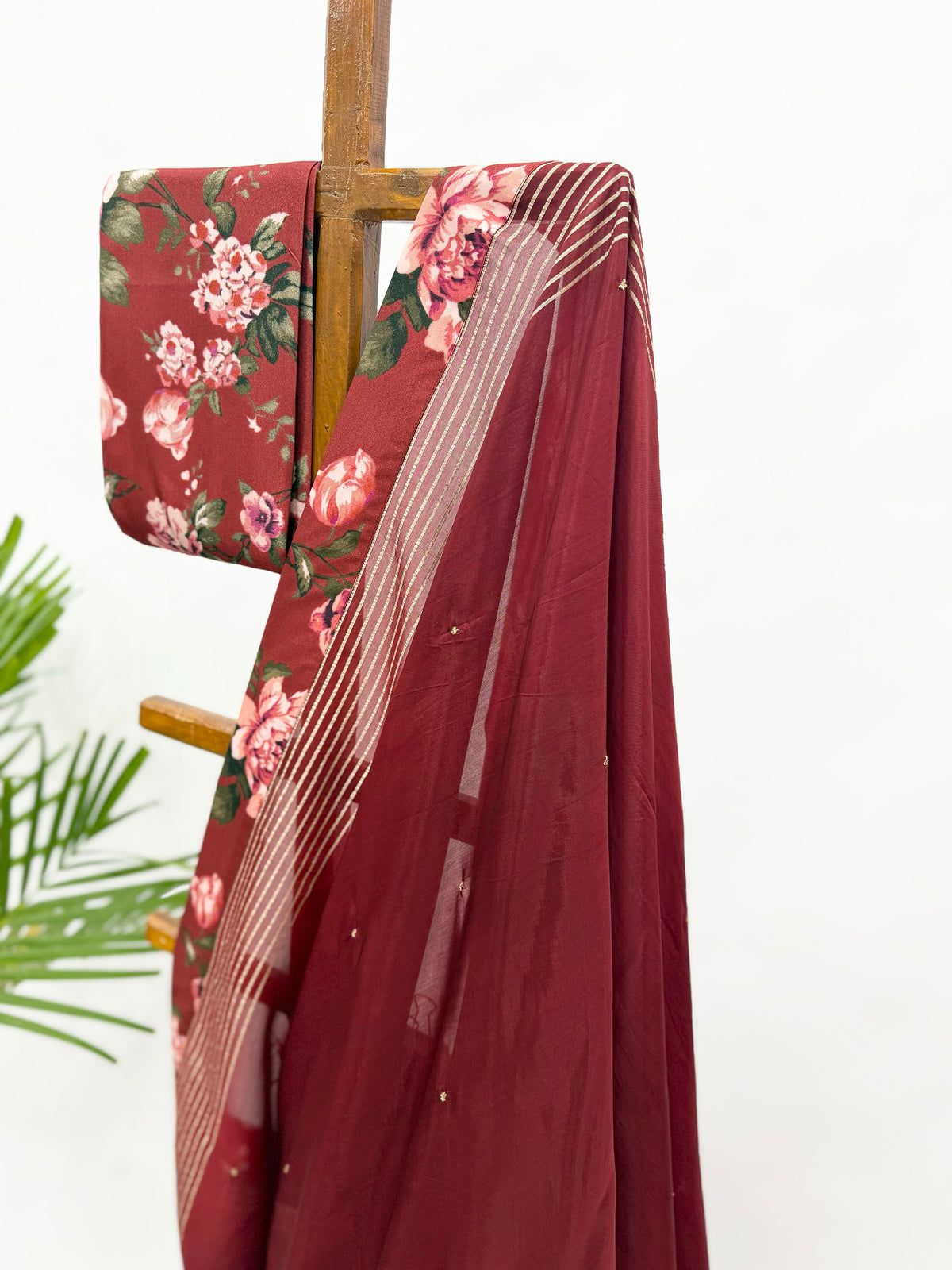 MAROON CREPE SILK SAREE WITH BEADS EMBELLISHMENT WITH FLORAL BLOUSE FABRIC