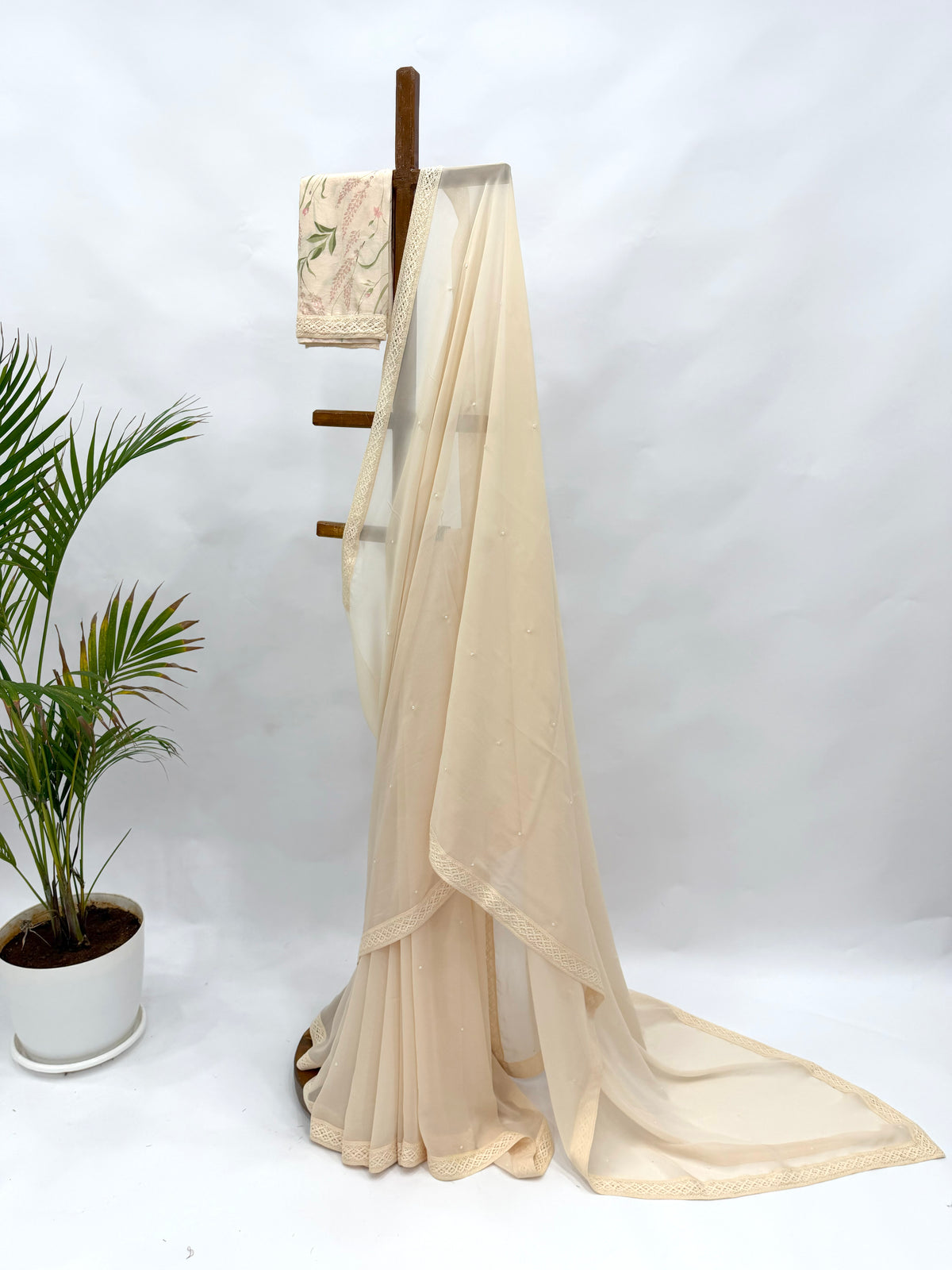 IVORY GEORGETTE SAREE WITH PEARL EMBELLISHMENT AND FLORAL BLOUSE FABRIC