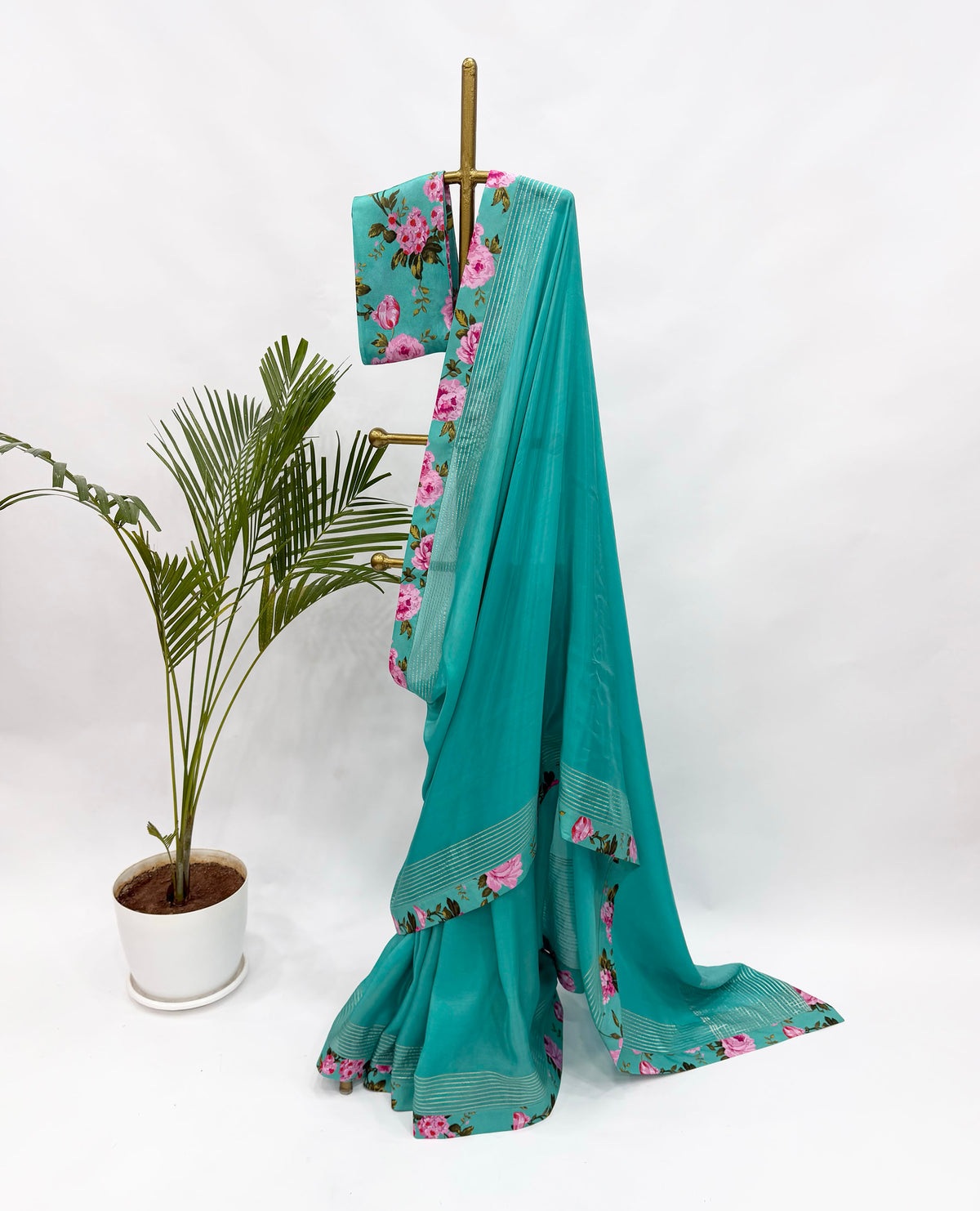 COPPER SULPHATE BLUE CREPE SILKS SAREE WITH FLORAL BLOUSE FABRIC