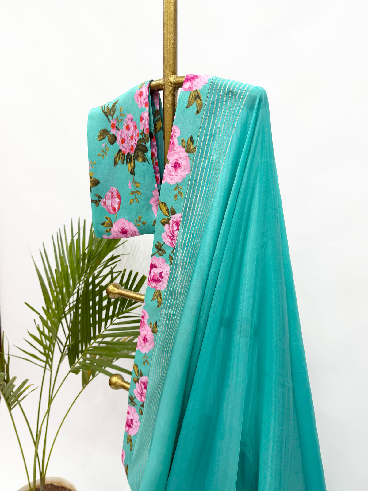 COPPER SULPHATE BLUE CREPE SILKS SAREE WITH FLORAL BLOUSE FABRIC