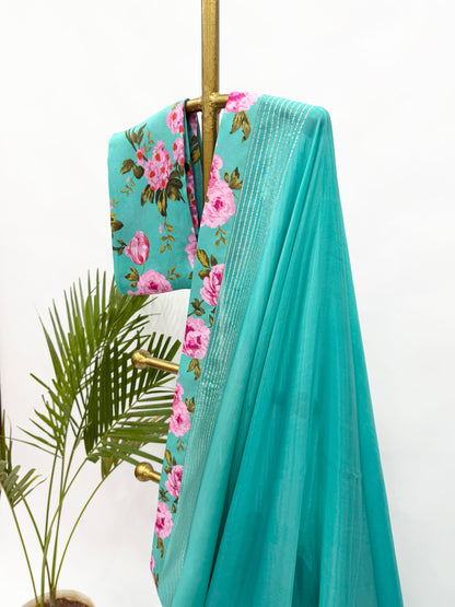 COPPER SULPHATE BLUE CREPE SILKS SAREE WITH FLORAL BLOUSE FABRIC