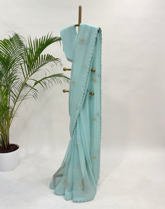 BLUE FALLING ORGANZA SAREE WITH THREAD MOTIFS AND UNSTITCHED BLOUSE FABRIC