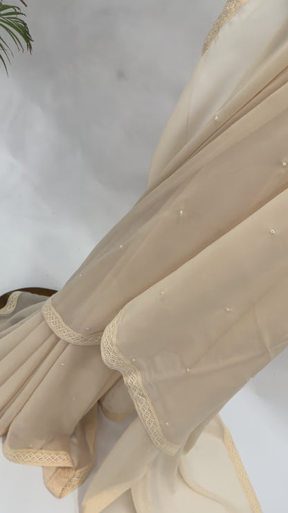 IVORY GEORGETTE SAREE WITH PEARL EMBELLISHMENT AND FLORAL BLOUSE FABRIC