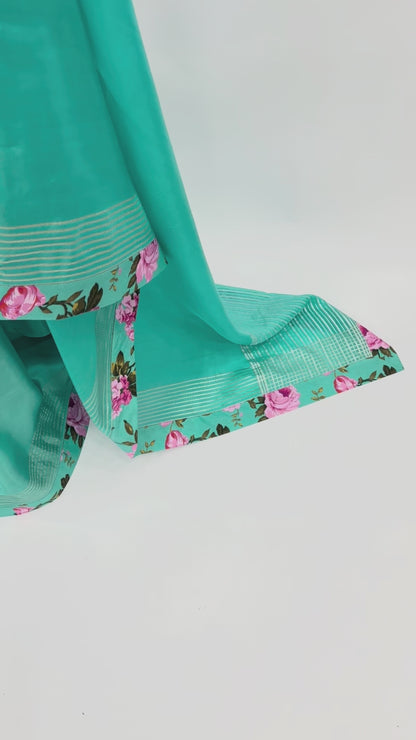 COPPER SULPHATE BLUE CREPE SILKS SAREE WITH FLORAL BLOUSE FABRIC